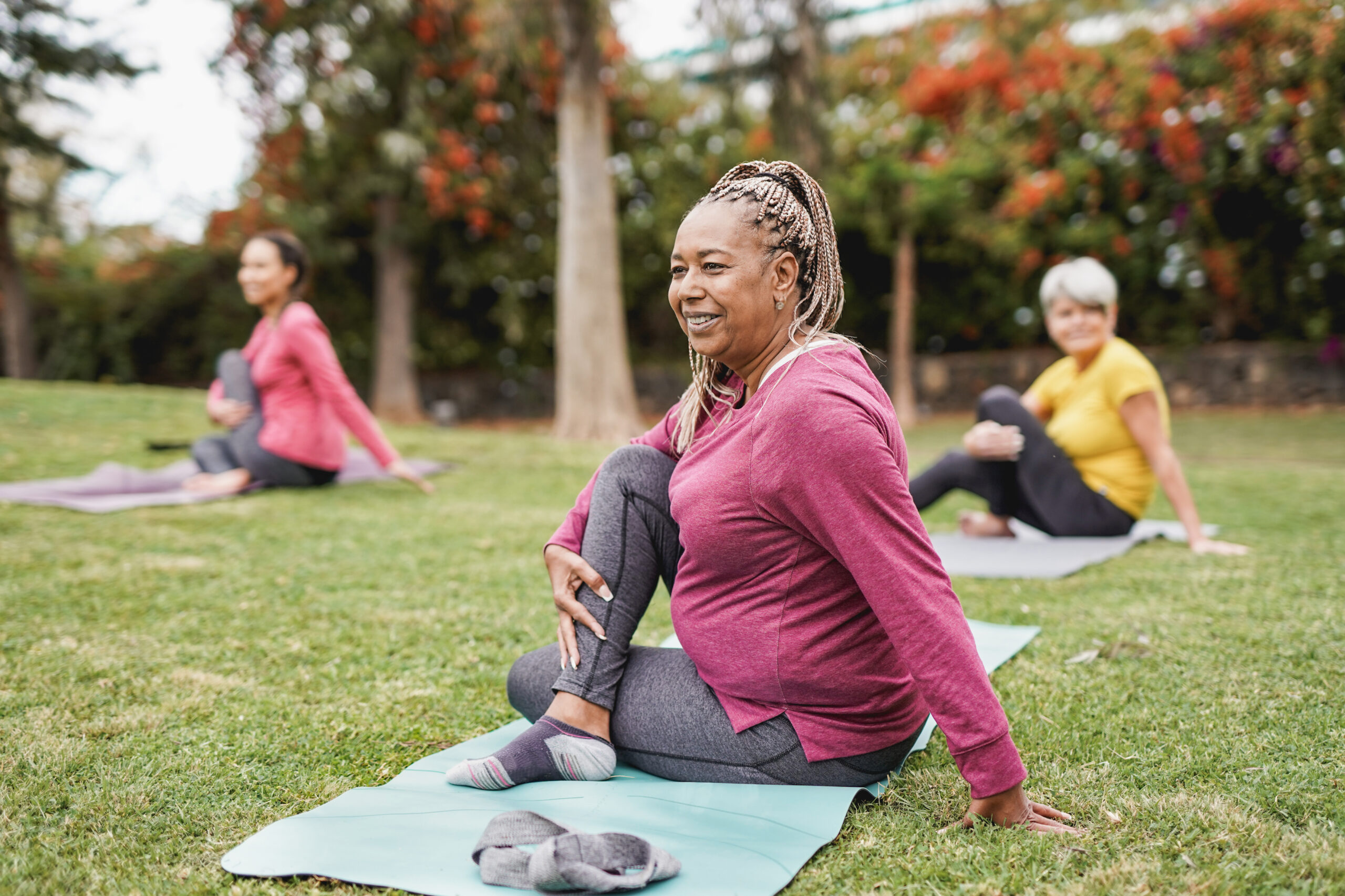 women stretching outdoors